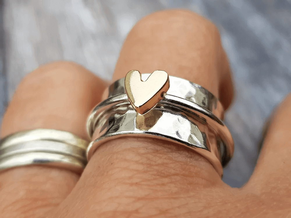 Silver ring with gold heart