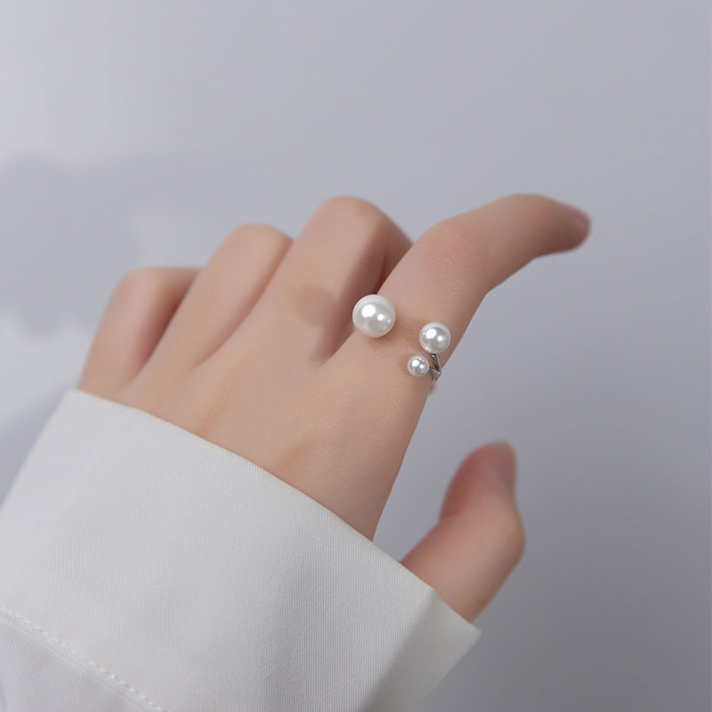 Elegant Ring with Trio of Pearls